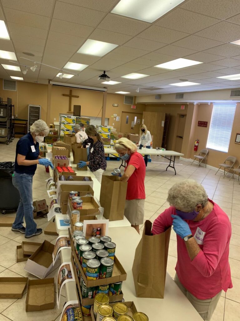 First UMC crew packing non perishables for the community